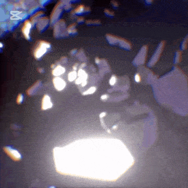 a blurry image of a person 's face with the letter m on the bottom