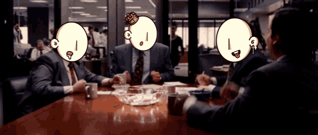 a group of men sit at a table with cartoon faces on their faces