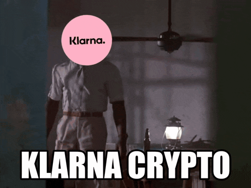 a man stands in a dark room with a pink circle with the word klarna on it