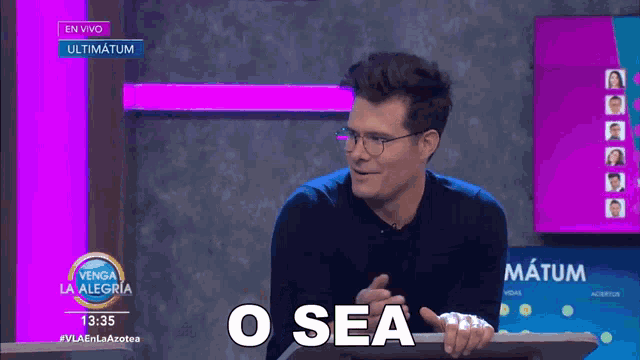 a man stands at a podium with the words o sea on the screen