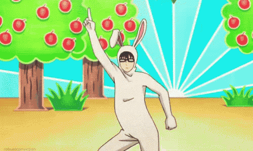 a man in a bunny suit is dancing in front of a tree with apples .