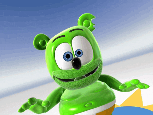 a green gummy bear with blue eyes is standing in front of a blue background