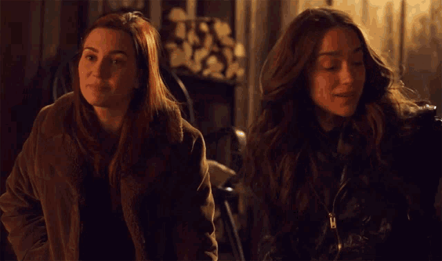 two women are sitting next to each other with the words " there are no good men left "