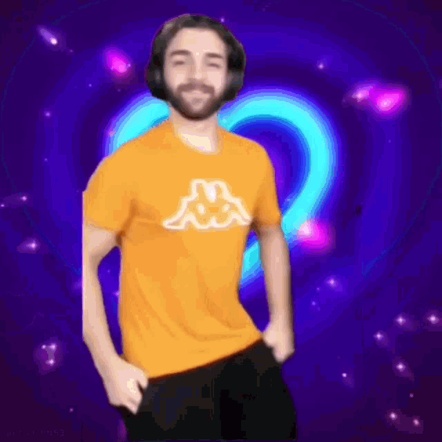 a man in a kappa shirt is dancing in front of a heart