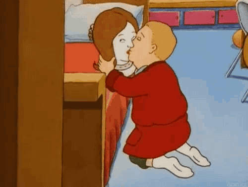 a cartoon of a man kissing a woman 's head in a bedroom .