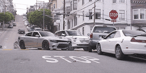a stop sign is above a busy street