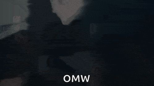 a close up of a person 's face with the words `` omw '' written on the bottom .