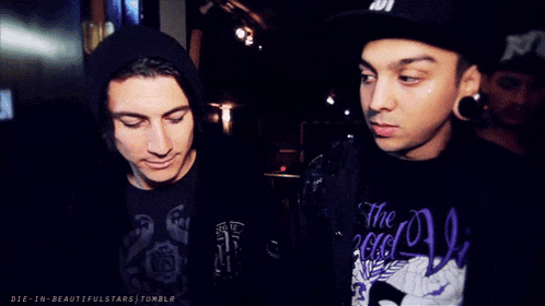 two men are posing for a picture and one of them is wearing a shirt that says die-in-beautifulstars tumblr