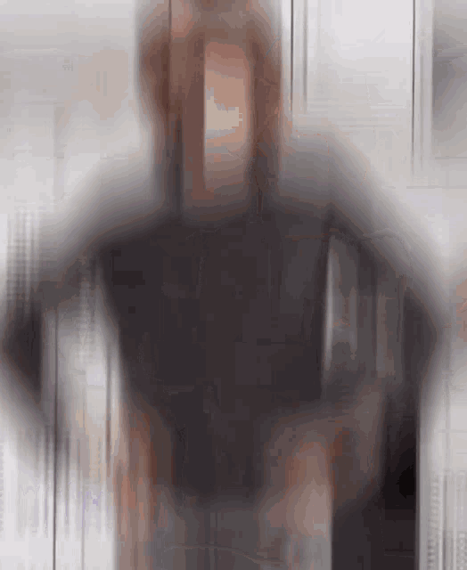a blurry picture of a person in a black jacket