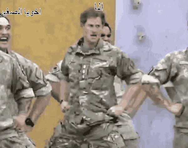 a group of soldiers are dancing in front of a yellow wall