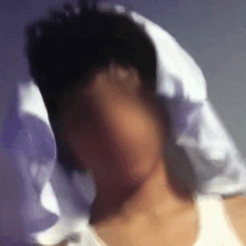 a blurry picture of a person wearing a white shirt