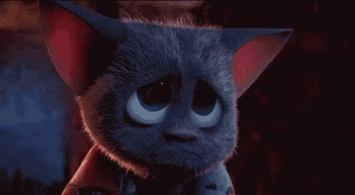 a cartoon cat with a sad look on its face is looking at the camera .