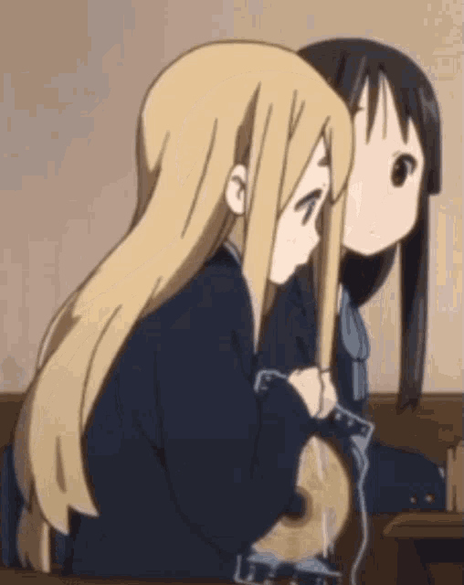 two anime girls are sitting next to each other and one is holding a guitar
