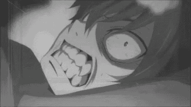 it is a black and white photo of a person with a very angry face .