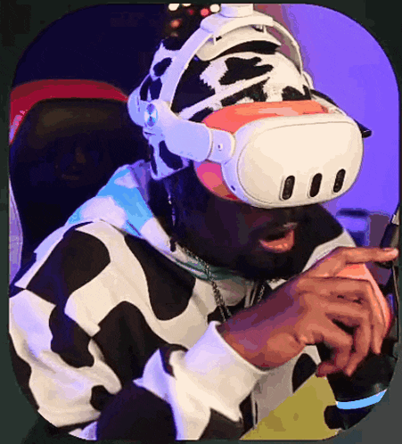 a man wearing a virtual reality headset and a cow print hat