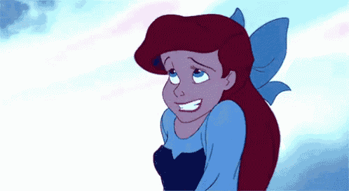 ariel from the little mermaid is smiling and wearing a blue dress with a blue bow .