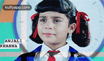 a little girl wearing a tie and bows is crying .