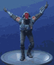a statue of a man in a futuristic suit is dancing on a blue background .