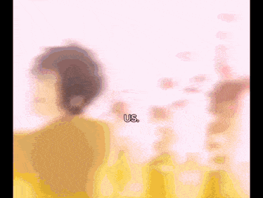 a blurry picture of a person with the words us written on the bottom