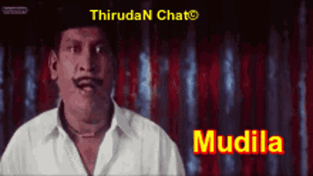 a man with a mustache is standing in front of a sign that says " mudila "