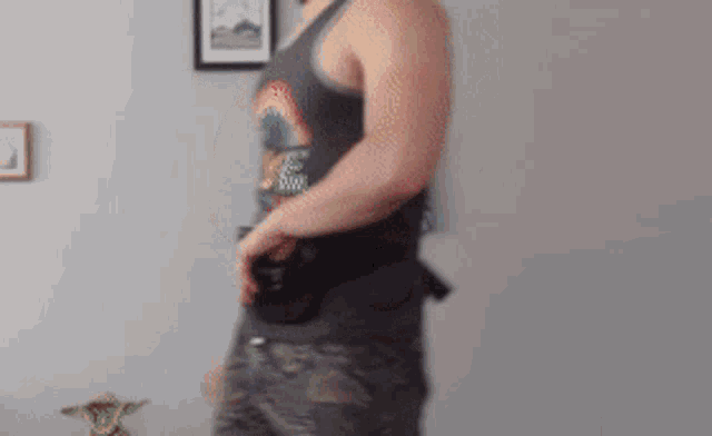 a man wearing a tank top that says love