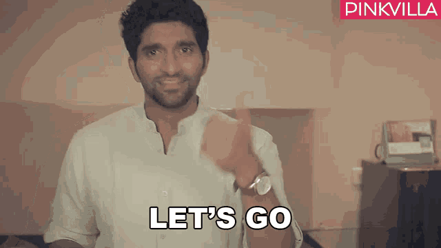 a man says let 's go in front of a pink villa logo