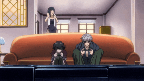 a group of anime characters sitting on a couch playing video games