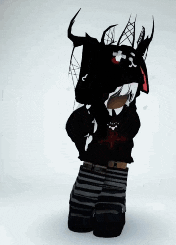 a person wearing a black hoodie with a cross on it