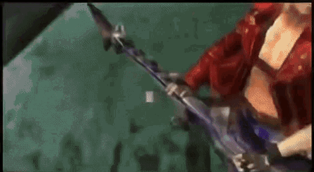 a man in a red coat is holding a sword