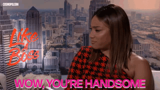 a woman says wow you 're handsome with a city in the background