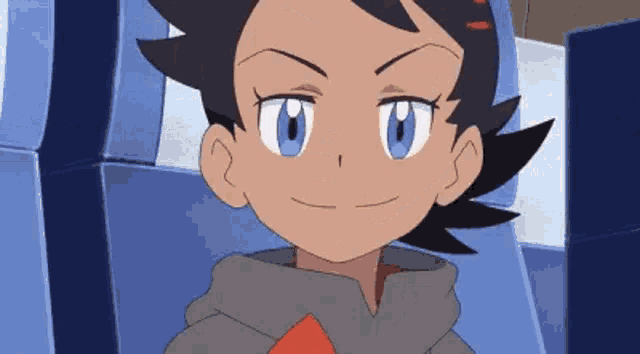a close up of a cartoon character 's face with blue eyes and a hoodie .