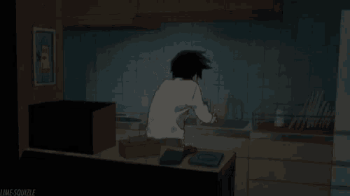 a man in a white shirt is standing in a dark kitchen with a picture on the wall that says lime-squizle