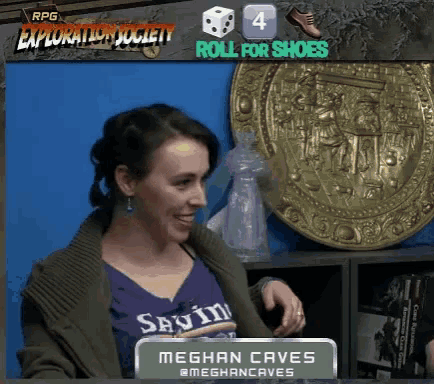 a woman in a purple shirt with the name meghan caves on the front