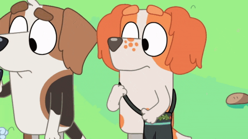two cartoon dogs are standing next to each other on a green field .