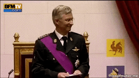 a man in a military uniform is sitting in front of a bfmtv.com logo