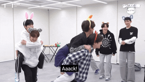 a group of boys are playing a game and one of them says aaack