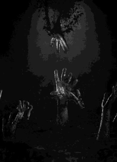 a black and white photo of a group of zombie hands giving the peace sign