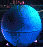 a pixelated image of a blue ball with a reflection