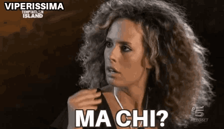 a woman with curly hair is making a funny face and asking , ma chi ?