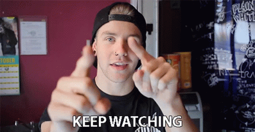 Keep Watching Stay Tuned GIF - Keep Watching Stay Tuned Pointing GIFs