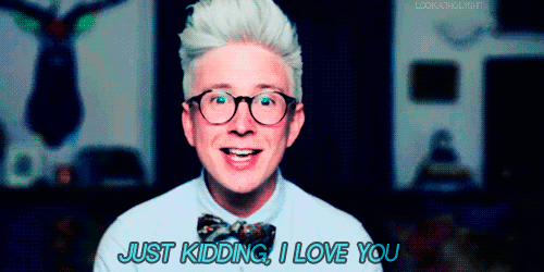 a man wearing glasses says just kidding i love you