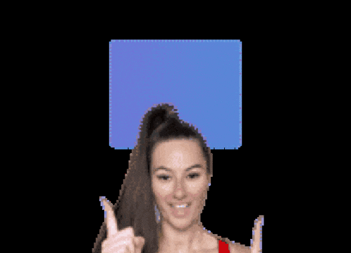 a woman is giving a thumbs up in front of a sign that says kin