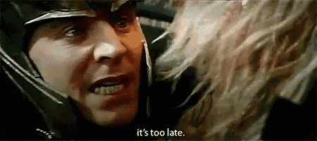 a man in a helmet is talking to a woman in a movie .