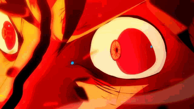 a close up of a cartoon character 's eye with a red eye and a blue pupil .