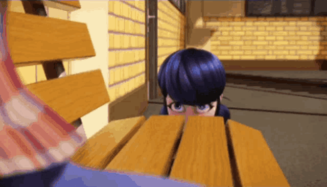 a girl with blue hair is sitting at a wooden table
