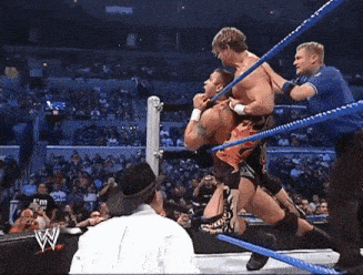 a wrestling match with the letter w on the bottom