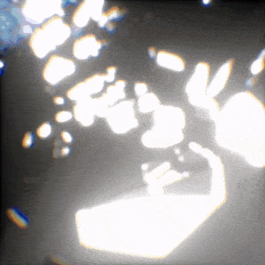 a blurry picture of a person 's face with a few spots of light on it