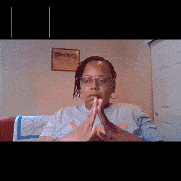 a woman is sitting in front of a pink screen that says never teach a man