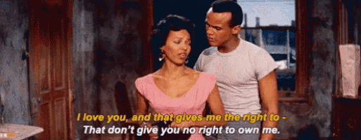 a man and a woman are standing next to each other and the woman is saying i love you