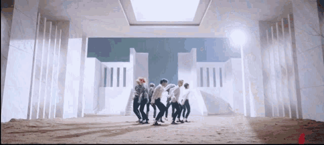 a group of people are dancing in front of a large white building